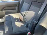 a seat in the back of a car with a bottle in it