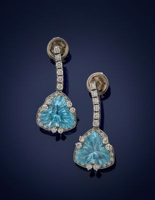 a pair of blue topaze and diamond earrings