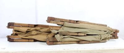 several pieces of wood are stacked on top of each other on a white surface