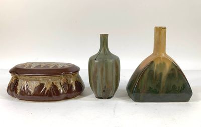 three vases sitting next to each other on a table
