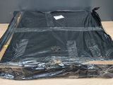 a black bag that is sitting on top of a wooden table