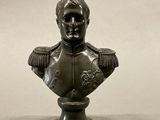 statue of a bust of a man in a military uniform on a pedestal