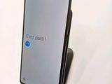 the back of a black samsung phone with a text on the screen