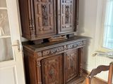 a large wooden cabinet in the corner of a room