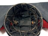 a close up of a baseball helmet with a bat in it