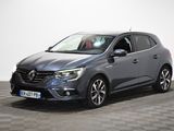une Renault Grand Tourer grise garée sur un sol à damier