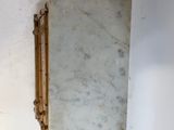 a mirror hanging on the wall above a sink