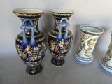 three vases sitting next to each other on a table