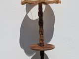 a lamp that is sitting on a table next to a wall