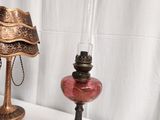 a lamp that is on a table next to a lamp