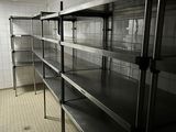 a long metal shelf in the middle of a room