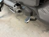 a close up of a motor scooter parked in a garage