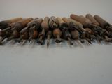a lot of wooden tools that are sitting on a table