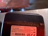 a close up of a red and black object on a table