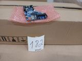 a cardboard box with a small electronic device on it