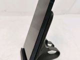 a cell phone that is sitting on a cell phone stand