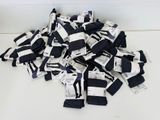 a pile of black and white striped socks on a table