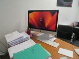 a desktop computer sitting on a desk in an office