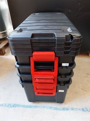 two black and red tool boxes sitting on top of each other