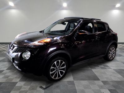the nissan juke suv is parked in a clean room