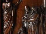 an image of a wood carving of jesus and other people