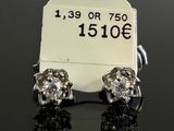 pair of diamond stud earrings with price tag and price tag