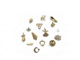 a close up of a bunch of charms on a white surface