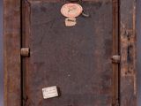 a picture of an old wooden picture frame with a tag on it