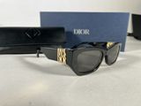 christian dior sunglasses with box and case on table