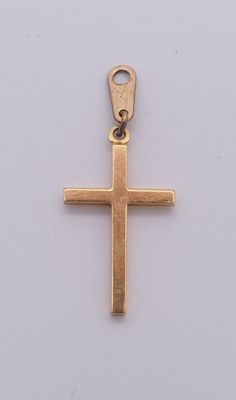 une croix dorée sur fond blanc