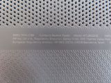 a close up of a metal plate with a name on it