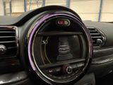 a car dashboard with a clock and a radio in it