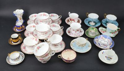many different types of tea cups and saucers on the table