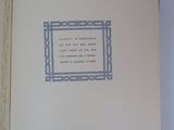 an open book with a picture of a cat and a quote on it