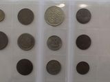 a lot of coins that are on display in a case