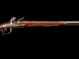 un vieux fusil au canon en bois sur fond noir