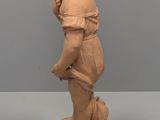 statue of a boy with a dog on a pedestal