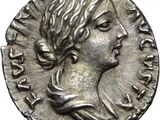 a silver coin with a woman ' s head on it