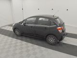 a picture of a small car parked in a garage