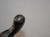a close up of a metal object with a bird on it
