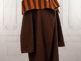an orange and brown striped coat on a mannequin mannequin mannequin mannequin mannequin mannequin mannequin mannequin