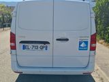 a white van that is parked on the side of the road