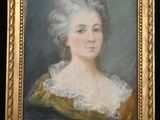 a painting of a woman in a green dress with a gold frame