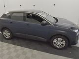a picture of a blue car parked on a checkered floor