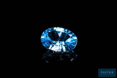 a blue diamond on a black background