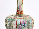 a vase that has a picture of a woman on it