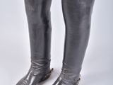pair of black leather boots with buckles on each side