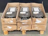 several boxes of electronic devices are stacked on top of each other