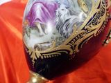 a vase with a picture of a woman and a horse painted on it