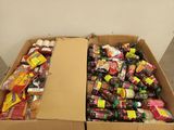 a cardboard box filled with assorted snacks and drinks